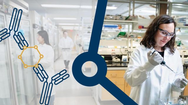 A scientist in a lab coat and safety glasses uses a pipette, with other people in lab coats and scientific graphics in the background. 