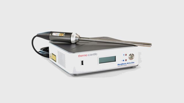 Thermo Scientific MarqMetrix All-In-One process Raman analyzer with attached probe on a white background 